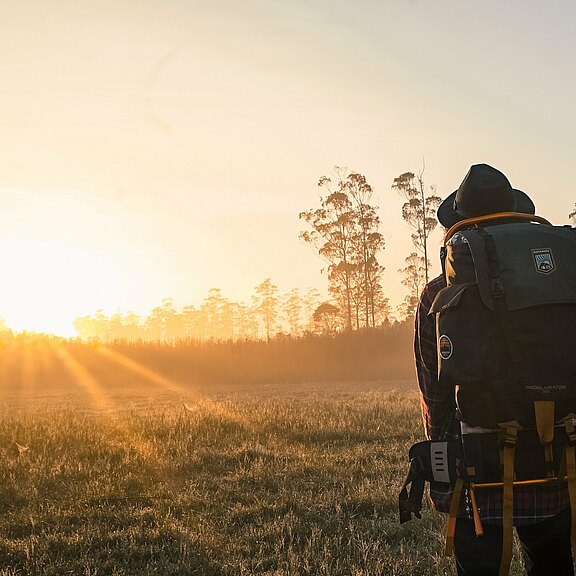 man-in-black-backpack-during-golden-hour-1230302.jpg 